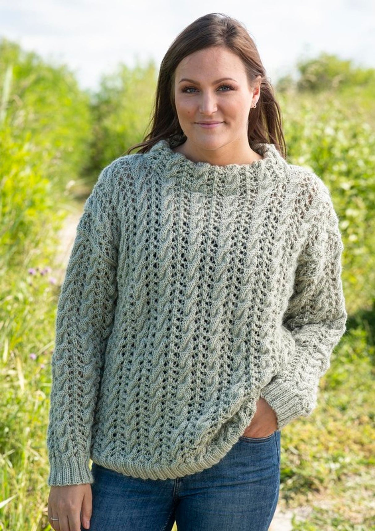 Sweater with lace pattern and cables