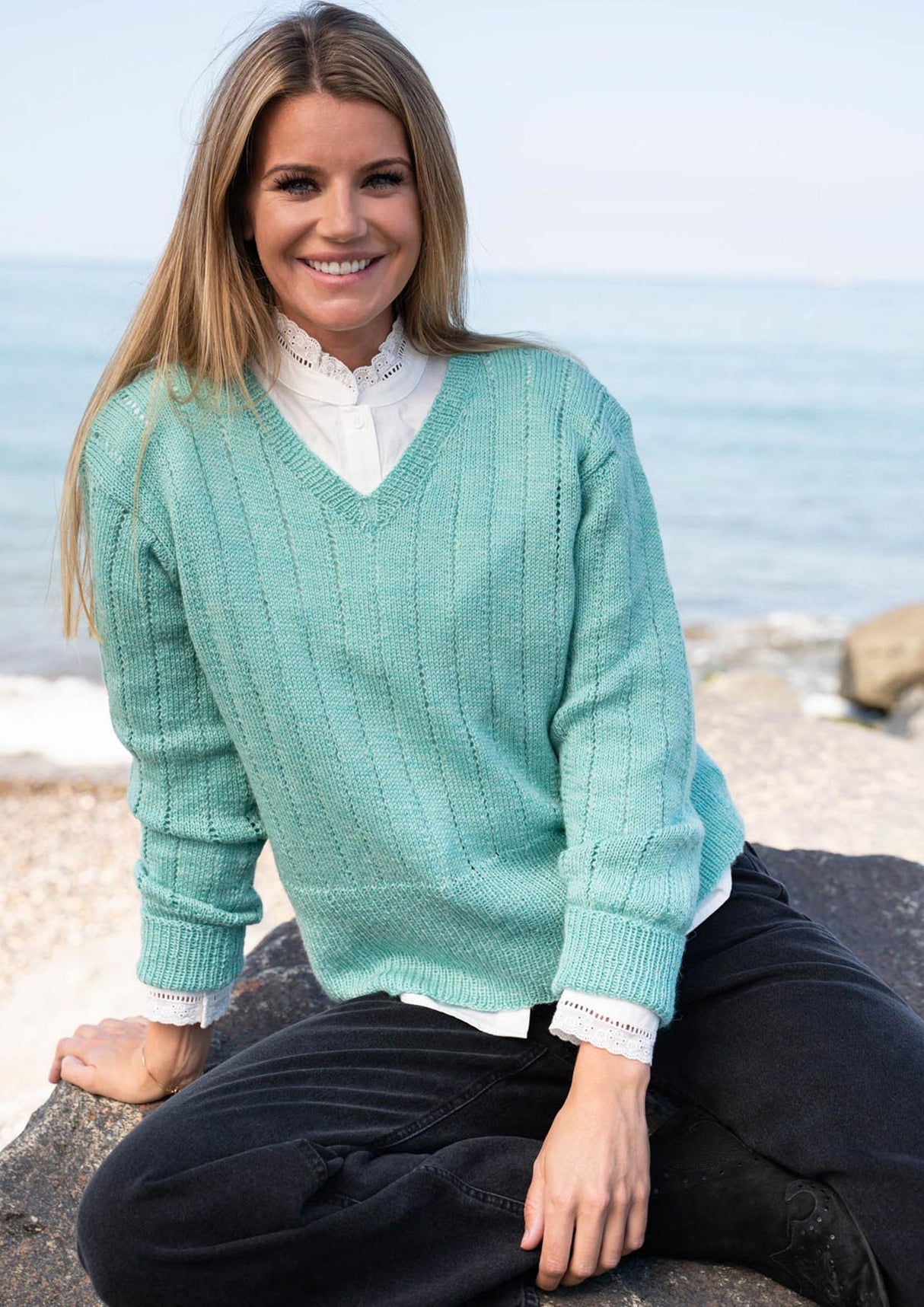 Sweater with vertical hole rows