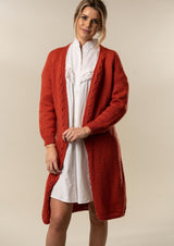 Knitted women's coat with cables