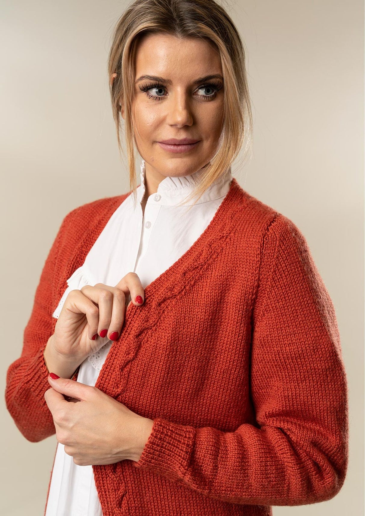 Knitted women's coat with cables